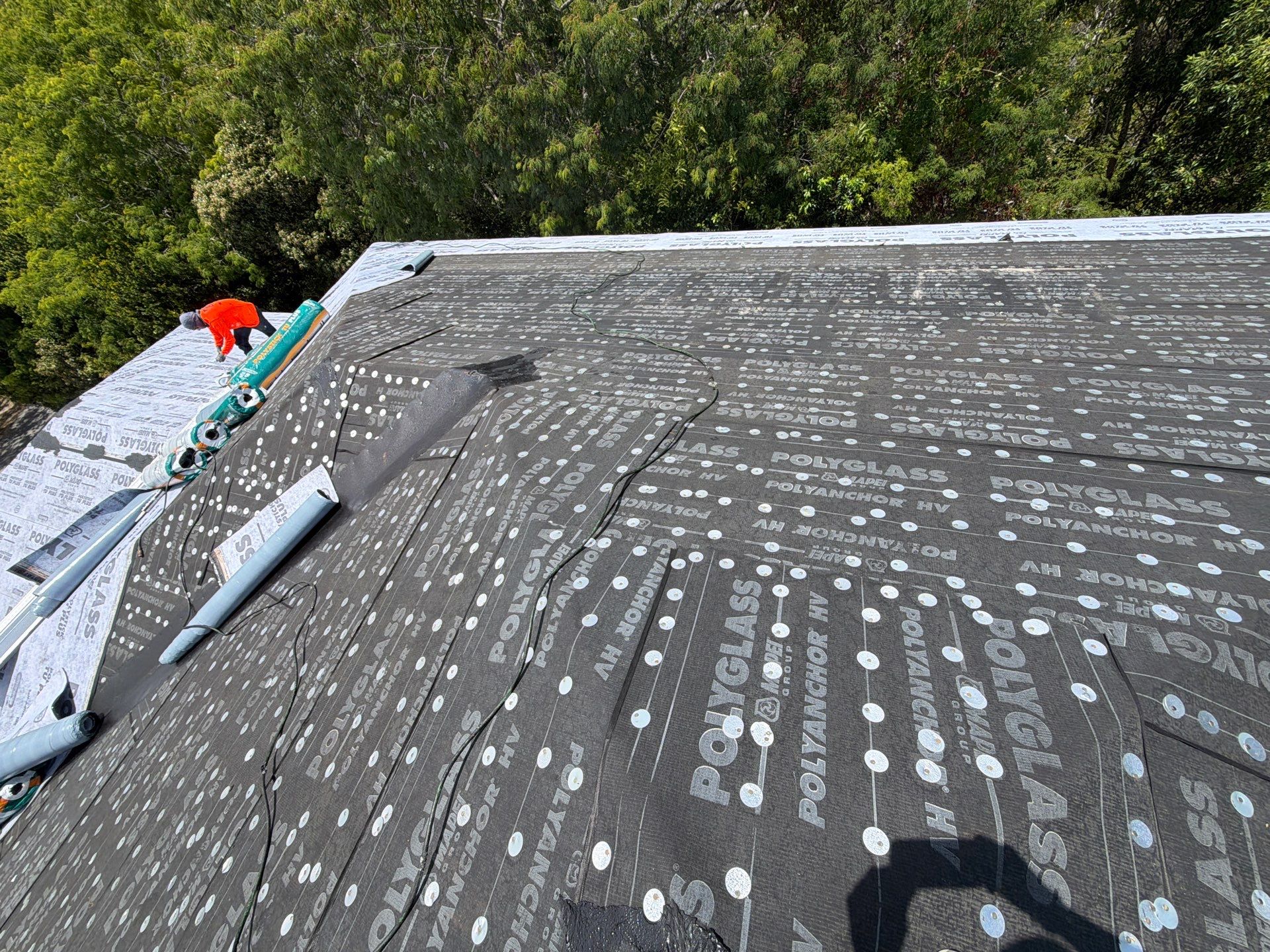 Professional roofing crew working on a South Florida home